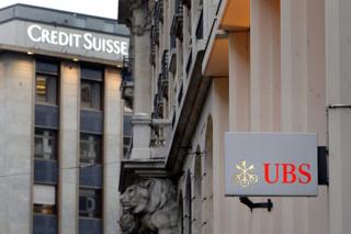 The logos of Swiss banks Credit Suisse and UBS